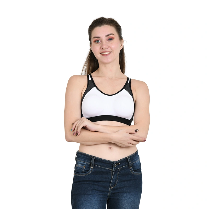 White and black colorblock racerback sports bra with blue denim jeans - lingerie ecommerce photography by Lohar Studio Delhi